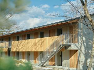 a building with a staircase on the side of it at SANU 2nd Home Nasu 3rd in Nasu