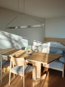 a dining room with a table and a bed at SANU 2nd Home Nasu 3rd in Nasu +56 photos