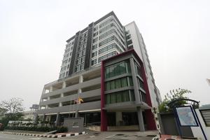 a tall building with a red and white at Cosy private suite 2BR 591 Nexus USJ Shah Alam in Shah Alam