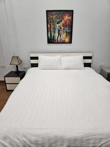 Ένα ή περισσότερα κρεβάτια σε δωμάτιο στο CoNes Hotel