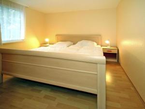 Giường trong phòng chung tại Feriendorf am Weinberg, Dobbrikow