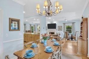 a kitchen and living room with a wooden table and chairs at SM07: 7 Silver Moss in Kiawah Island