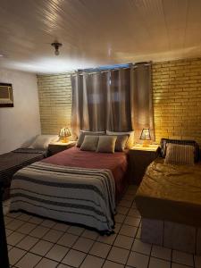 Voodi või voodid majutusasutuse Excellent house in Maceió Ipioca toas