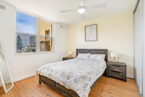 Una cama o camas en una habitación de Oceanfront Stay - Steps to the Sand