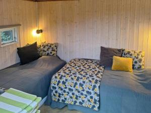 Giường trong phòng chung tại Holiday Home With Fjord Views Near Karrebæksminde
