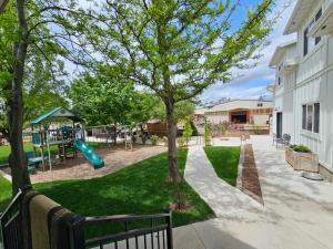 a park with a playground with a slide at The Pink Hayloft in Nephi
