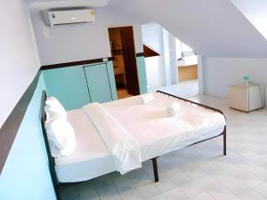 a hospital room with a bed and a staircase at oo Mitr Inn Phuket Island - Phuket Old Town yes in Phuket