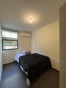 Ένα ή περισσότερα κρεβάτια σε δωμάτιο στο NU Lomas Garden +8 φωτογραφίες