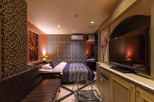 En eller flere senge i et værelse på Himeji Park Hotel (Adult Only)