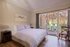 Ένα ή περισσότερα κρεβάτια σε δωμάτιο στο Tessies Studio