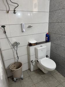 a bathroom with a toilet and a shower at Guest Stay Inn 1BHK in Zirakpur