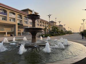 a water fountain in the middle of a street at Guest Stay Inn 1BHK in Zirakpur