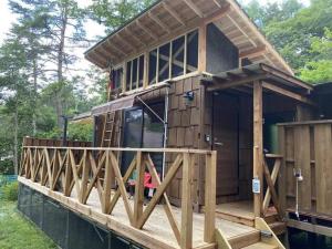 a large wooden house on top of the water at Tateshina Infinity Grand - Vacation STAY 40443v in Yukawa +14 photos
