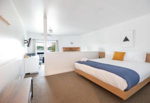 a bedroom with a large bed in a room at Bonnie View Inn in Haliburton