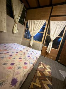 Ένα ή περισσότερα κρεβάτια σε δωμάτιο στο Lola Sayong Xanti 'Silong