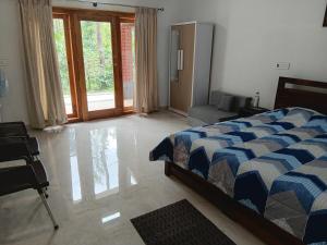 Postel nebo postele na pokoji v ubytování Thondalli Villa