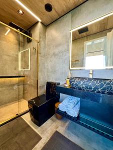 Et badeværelse på New Suite 14 Alto Luxo Beira Mar