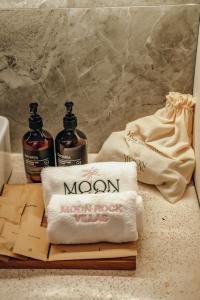 two bottles of moon moon rock sitting on a counter at Moon Rock Villas Ubud by Ribas in Gianyar