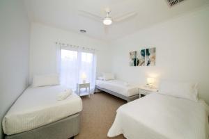 Ένα ή περισσότερα κρεβάτια σε δωμάτιο στο Waterfront Haven