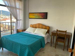 Una cama o camas en una habitación de HOTEL EJECUTIVO PITALITo