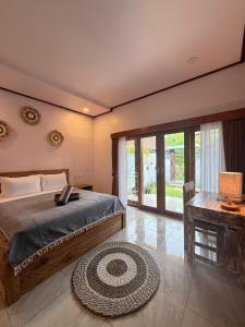 En eller flere senge i et værelse på Willy Apartement