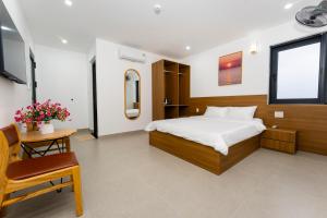 Μια τηλεόραση ή/και κέντρο ψυχαγωγίας στο Phú Châu Motel +17 φωτογραφίες