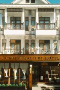 a hotel with a sign that reads la bule gallery hotel at LA BURIE HOTEL Chiang Mai in Chiang Mai