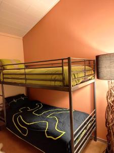 Ένα ή περισσότερα κρεβάτια σε δωμάτιο στο Le Rensy