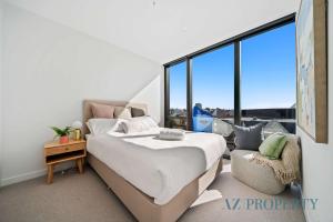 Ένα ή περισσότερα κρεβάτια σε δωμάτιο στο Prime Location CBD with Pool & Gym