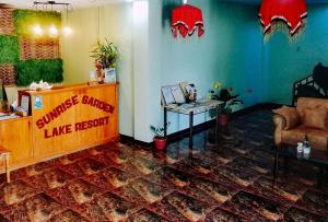 a living room with a service counter and a table at Sunrise Garden Lake Resort in Lahit +29 photos