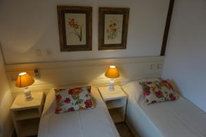 Cama ou camas em um quarto em Pousada Terra Juquehy