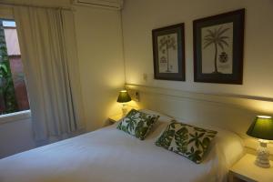 Cama ou camas em um quarto em Pousada Terra Juquehy