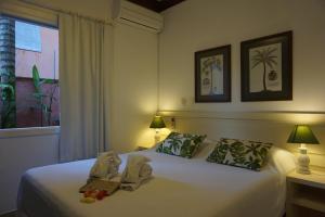 Cama ou camas em um quarto em Pousada Terra Juquehy