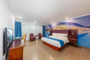 Μια τηλεόραση ή/και κέντρο ψυχαγωγίας στο Kui Chong Holiday Hotel