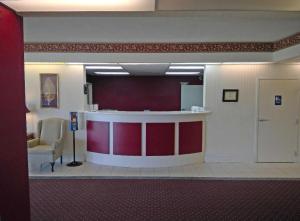 a hospital waiting room with a red and white counter at Americas Best Value Inn Kinston in Kinston