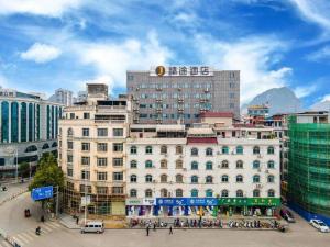 a large building in the middle of a city at JTOUR Inn Yizhou Hechi College Pedestrian Street in Yishan