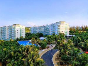an aerial view of a resort with palm trees at Ocean Vista Resort Sealink Phan Thiet in Ấp Phú Tịnh (2)