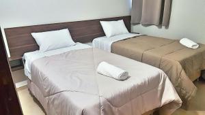 Voodi või voodid majutusasutuse Hotel Sur Brasil toas