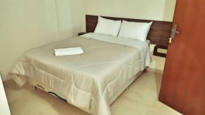 Voodi või voodid majutusasutuse Hotel Sur Brasil toas