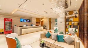 TV a/nebo společenská místnost v ubytování Echarm Hotel Tai'an Taishan Tianwai Village Hongmen