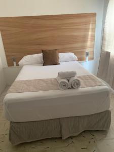 A bed or beds in a room at Casa Palmeras