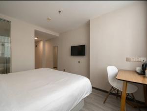 Μια τηλεόραση ή/και κέντρο ψυχαγωγίας στο Hanting Hotel Shenzhen Taian Subway Station