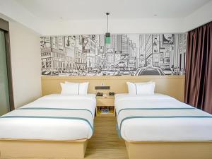 Ένα ή περισσότερα κρεβάτια σε δωμάτιο στο City Comfort Inn Yangxin High-speed Railway Station +177 φωτογραφίες