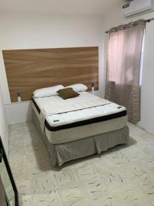 A bed or beds in a room at Casa Palmeras