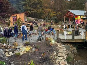 a group of people walking around in a yard at Mountain Harbour B&B in Roan Mountain