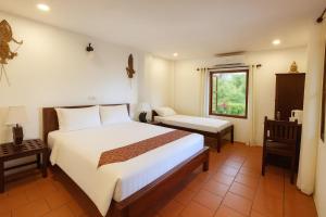 Voodi või voodid majutusasutuse Paradise K Forest Hotel toas