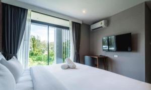 Postel nebo postele na pokoji v ubytování Stylish Beachfront 2BR Flat + 63 fotografií