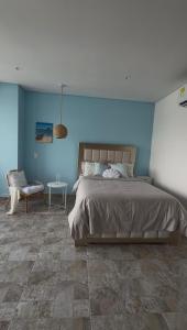 En eller flere senge i et værelse på Suite Blue - Rodadero Sur