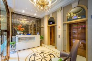 a lobby of a store with a chandelier at Harbour Bay Hotel in Hong Kong