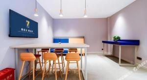 a meeting room with a table and chairs at 7 Days Inn Xi'an Xijing Hospital Tonghuamen Metro Station in Xi'an